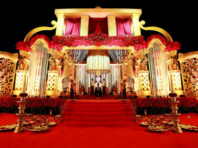 Bright Shade of Red Color Theme Wedding Hall Decoration with Beautiful Lightings.