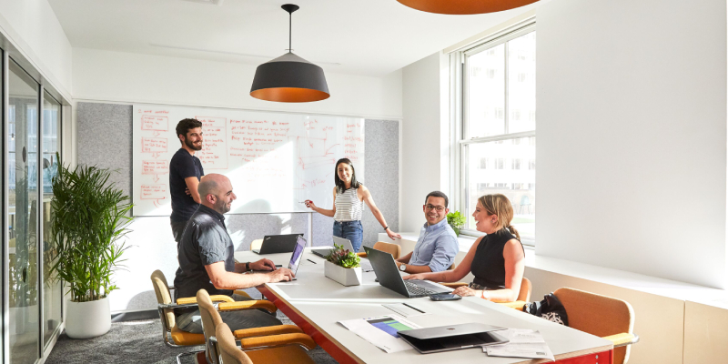 Group Of Business People Working Together In A Conference Room.