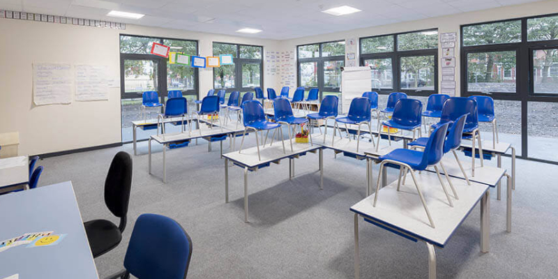 An Image Representing The Modern Classroom Interior With Empty Classroom Benches, Desks And Chairs.